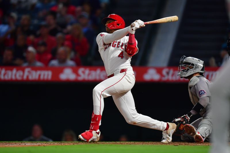 Jun 24, 2025; Anaheim, California, USA; Los Angeles Angels second baseman Christian Moore (4) hits a two run walk off home run against the Boston Red Sox during the tenth inning at Angel Stadium. Mandatory Credit: Gary A. Vasquez-Imagn Images