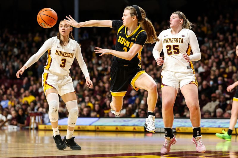 Feb 28, 2024; Minneapolis, Minnesota, USA; Iowa Hawkeyes guard Molly Davis (1) passes against the Minnesota Golden Gophers during the second half at Williams Arena. Mandatory Credit: Matt Krohn-USA TODAY Sports