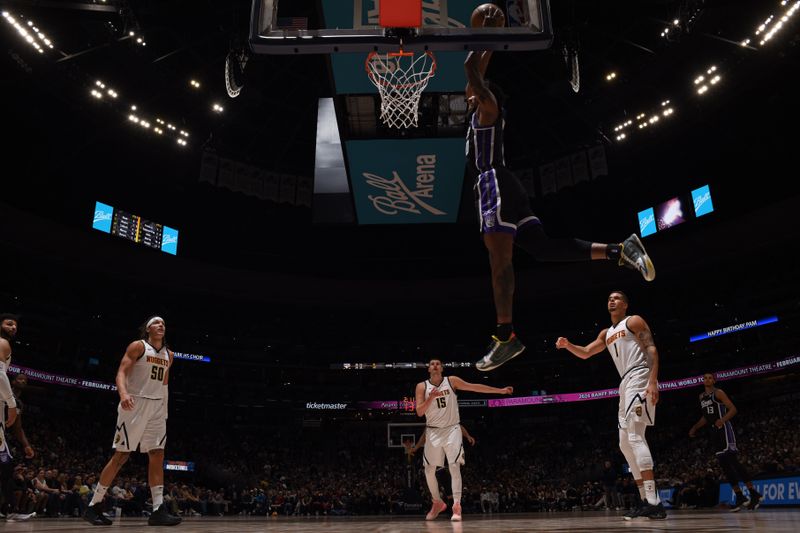 DENVER, CO - FEBRUARY 28: Malik Monk #0 of the Sacramento Kings dunks the ball during the game against the Denver Nuggets on February 28, 2024 at the Ball Arena in Denver, Colorado. NOTE TO USER: User expressly acknowledges and agrees that, by downloading and/or using this Photograph, user is consenting to the terms and conditions of the Getty Images License Agreement. Mandatory Copyright Notice: Copyright 2024 NBAE (Photo by Garrett Ellwood/NBAE via Getty Images)