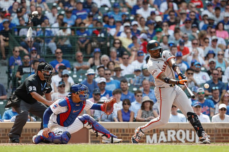 Jun 19, 2024; Chicago, Illinois, USA; San Francisco Giants designated hitter Jorge Soler (2) hits a grand slam against the Chicago Cubs during the eight inning at Wrigley Field. Mandatory Credit: Kamil Krzaczynski-USA TODAY Sports