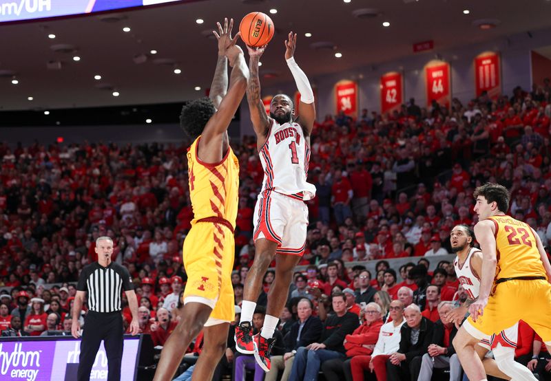 Feb 19, 2024; Houston, Texas, USA; Houston Cougars guard Jamal Shead (1) shoots the ball over Iowa State Cyclones forward Hason Ward (24) during the second half at Fertitta Center. Mandatory Credit: Troy Taormina-USA TODAY Sports