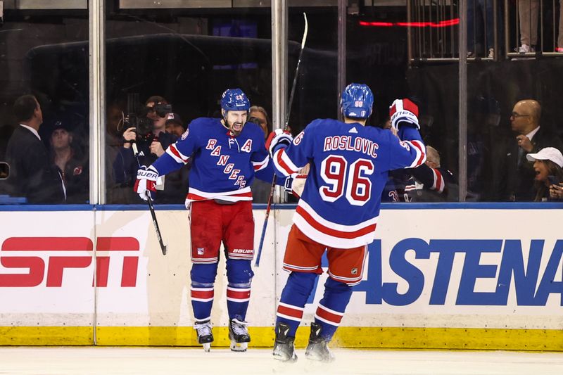 Apr 21, 2024; New York, New York, USA; New York Rangers left wing Chris Kreider (20) is greeted by New York Rangers center Jack Roslovic (96) after scoring a goal in the third period against the Washington Capitals in game one of the first round of the 2024 Stanley Cup Playoffs at Madison Square Garden. Mandatory Credit: Wendell Cruz-USA TODAY Sports