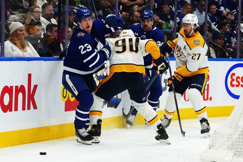 Dec 9, 2023; Toronto, Ontario, CAN; Toronto Maple Leafs left wing Matthew Knies (23) battles for the puck with Nashville Predators center Ryan O'Reilly (90) during the first period at Scotiabank Arena. Mandatory Credit: Nick Turchiaro-USA TODAY Sports