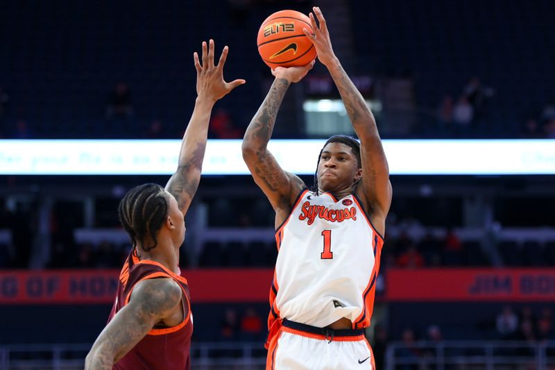 Jan 21, 2026; Syracuse, New York, USA; Syracuse Orange forward Donnie Freeman (1) shoots against Virginia Tech Hokies forward Tobi Lawal (1) during the second half at the JMA Wireless Dome. Mandatory Credit: Rich Barnes-Imagn Images