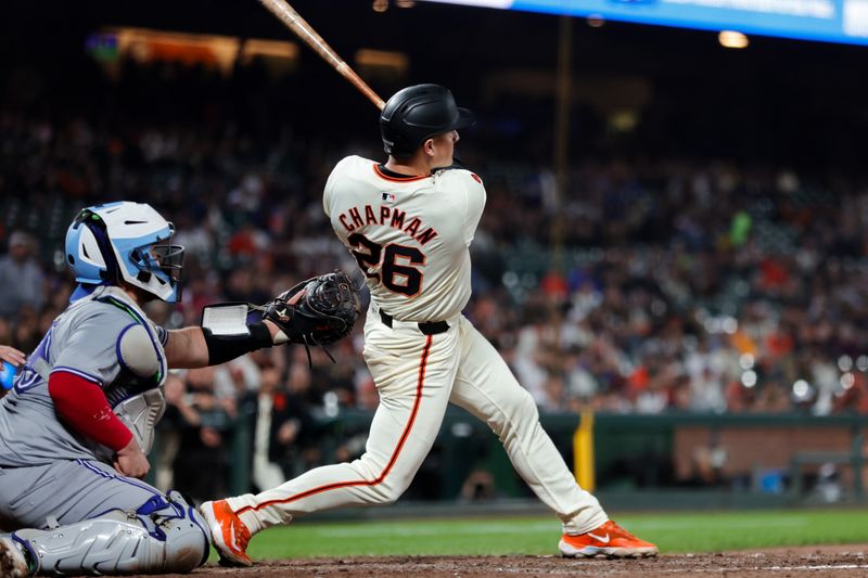 Jul 10, 2024; San Francisco, California, USA; San Francisco Giants third baseman Matt Chapman (26) hits a home run during the ninth inning against the Toronto Blue Jays at Oracle Park. Mandatory Credit: Sergio Estrada-USA TODAY Sports