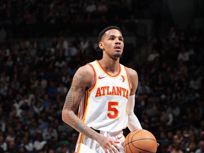 MINNEAPOLIS, MN -  APRIL 12: Dejounte Murray #5 of the Atlanta Hawks shoots a free throw during the game against the Minnesota Timberwolves on April 12, 2024 at Target Center in Minneapolis, Minnesota. NOTE TO USER: User expressly acknowledges and agrees that, by downloading and or using this Photograph, user is consenting to the terms and conditions of the Getty Images License Agreement. Mandatory Copyright Notice: Copyright 2024 NBAE (Photo by David Sherman/NBAE via Getty Images)