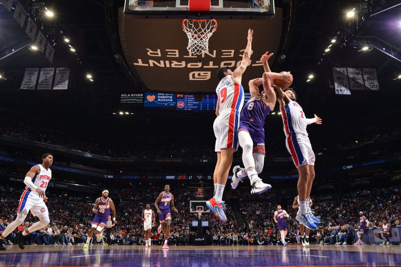 PHOENIX, AZ - FEBRUARY 14:  Cade Cunningham #2 and Simone Fontecchio #19 of the Detroit Pistons plays defense against Grayson Allen #8 of the Phoenix Suns on February 14, 2024 at Footprint Center in Phoenix, Arizona. NOTE TO USER: User expressly acknowledges and agrees that, by downloading and or using this photograph, user is consenting to the terms and conditions of the Getty Images License Agreement. Mandatory Copyright Notice: Copyright 2024 NBAE (Photo by Barry Gossage/NBAE via Getty Images)