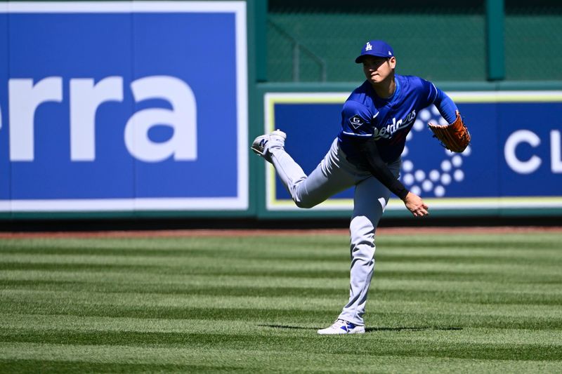 Apr 9, 2025; Washington, District of Columbia, USA; Los Angeles Dodgers two-way player Shohei Ohtani (17) warms up before the game against the Washington Nationals at Nationals Park. Mandatory Credit: Brad Mills-Imagn Images