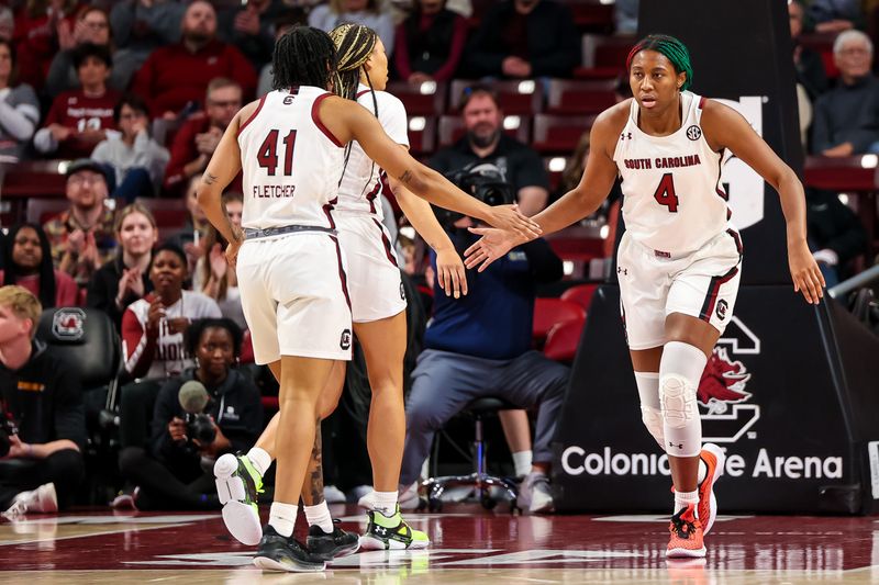 Jan 15, 2023; Columbia, South Carolina, USA; South Carolina Gamecocks forward Aliyah Boston (4) and South Carolina Gamecocks guard Kierra Fletcher (41) celebrate a play against the Missouri Tigers in the first half at Colonial Life Arena. Mandatory Credit: Jeff Blake-USA TODAY Sports