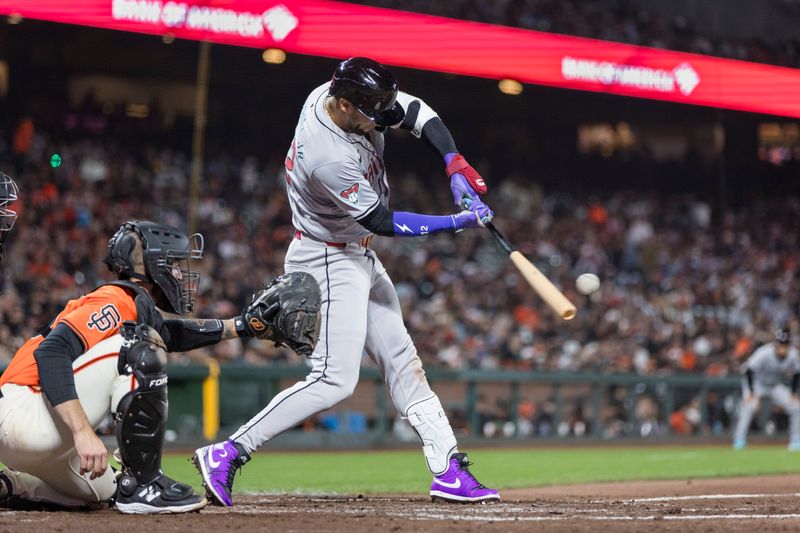 Apr 19, 2024; San Francisco, California, USA;  Arizona Diamondbacks left fielder Lourdes Gurriel Jr. (12) hits a single against the San Francisco Giants during the seventh inning at Oracle Park. Mandatory Credit: John Hefti-USA TODAY Sports