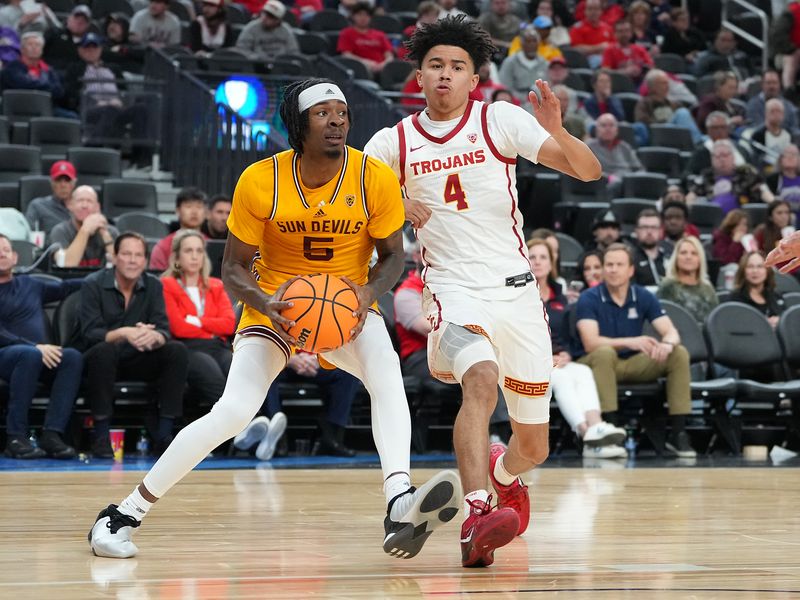 Mar 9, 2023; Las Vegas, NV, USA; Arizona State Sun Devils forward Jamiya Neal (5) drives against USC Trojans guard Oziyah Sellers (4) during the first half at T-Mobile Arena. Mandatory Credit: Stephen R. Sylvanie-USA TODAY Sports