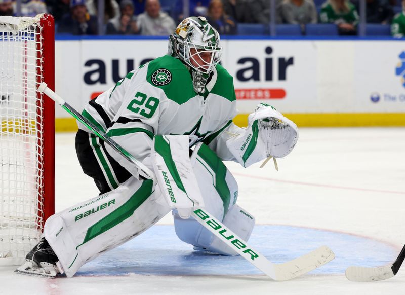 Oct 22, 2024; Buffalo, New York, USA;  Dallas Stars goaltender Jake Oettinger (29) looks for the puck during the second period against the Buffalo Sabres at KeyBank Center. Mandatory Credit: Timothy T. Ludwig-Imagn Images