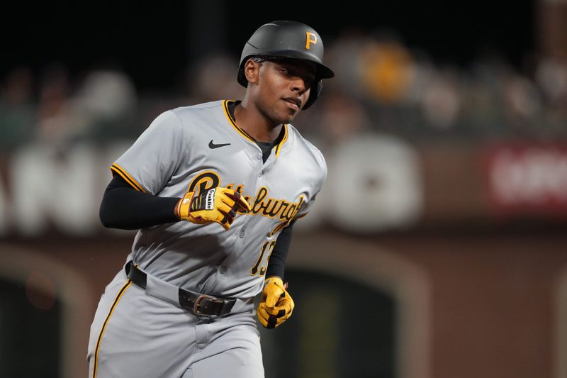 Apr 27, 2024; San Francisco, California, USA; Pittsburgh Pirates third baseman Ke'Bryan Hayes (13) rounds the bases after hitting a home run against the San Francisco Giants during the tenth inning at Oracle Park. Mandatory Credit: Darren Yamashita-USA TODAY Sports