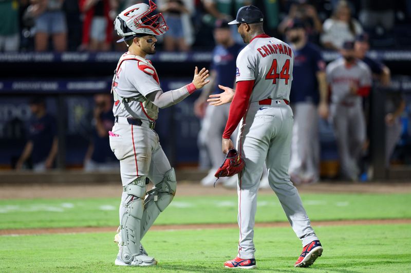 Sep 20, 2025; Tampa, Florida, USA; Boston Red Sox pitcher Aroldis Chapman (44) and catcher Carlos Narvaez (75) react after beating the Tampa Bay Rays at George M. Steinbrenner Field. Mandatory Credit: Nathan Ray Seebeck-Imagn Images