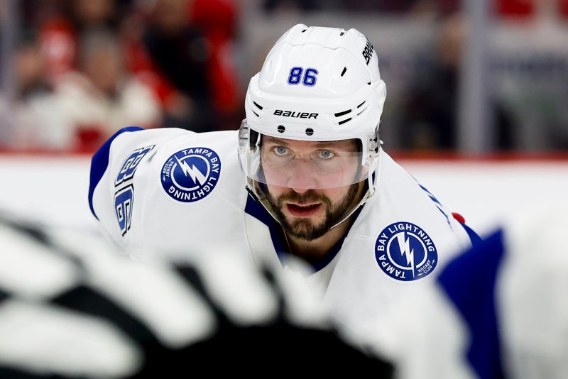 Jan 25, 2025; Detroit, Michigan, USA;  Tampa Bay Lightning right wing Nikita Kucherov (86) gets set during a face off in the third period against the Detroit Red Wings at Little Caesars Arena. Mandatory Credit: Rick Osentoski-Imagn Images