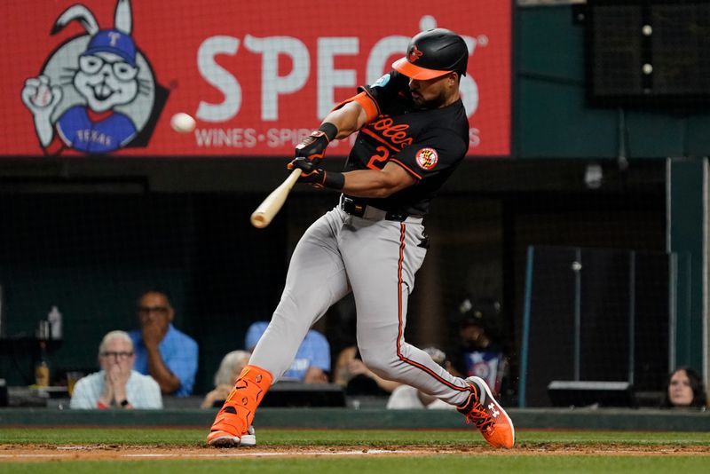 Jul 19, 2024; Arlington, Texas, USA; Baltimore Orioles outfielder Anthony Santander (25) hits a two-run home run during the fifth inning against the Texas Ranger at Globe Life Field. Mandatory Credit: Raymond Carlin III-USA TODAY Sports