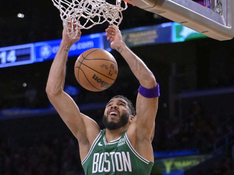 LOS ANGELES, CALIFORNIA - DECEMBER 25: Jayson Tatum #0 of the Boston Celtics goes up for a dunk in the second half against the Los Angeles Lakers at Crypto.com Arena on December 25, 2023 in Los Angeles, California. NOTE TO USER: User expressly acknowledges and agrees that, by downloading and or using this photograph, User is consenting to the terms and conditions of the Getty Images License Agreement.(Photo by Jayne Kamin-Oncea/Getty Images)