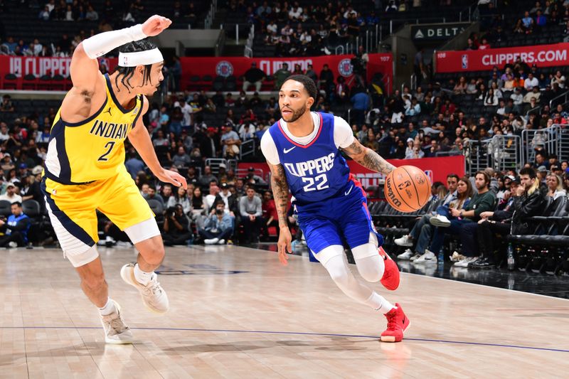 LOS ANGELES, CA - MARCH 25: Xavier Moon #22 of the LA Clippers dribbles the ball during the game against the Indiana Pacers on March 25, 2024 at Crypto.Com Arena in Los Angeles, California. NOTE TO USER: User expressly acknowledges and agrees that, by downloading and/or using this Photograph, user is consenting to the terms and conditions of the Getty Images License Agreement. Mandatory Copyright Notice: Copyright 2024 NBAE (Photo by Adam Pantozzi/NBAE via Getty Images)