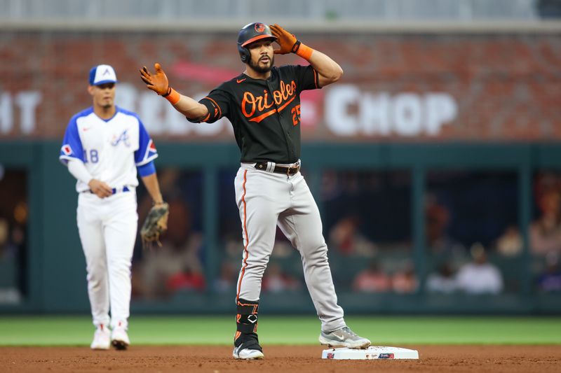 May 6, 2023; Atlanta, Georgia, USA; Baltimore Orioles right fielder Anthony Santander (25) celebrates after a double against the Atlanta Braves in the fourth inning at Truist Park. Mandatory Credit: Brett Davis-USA TODAY Sports