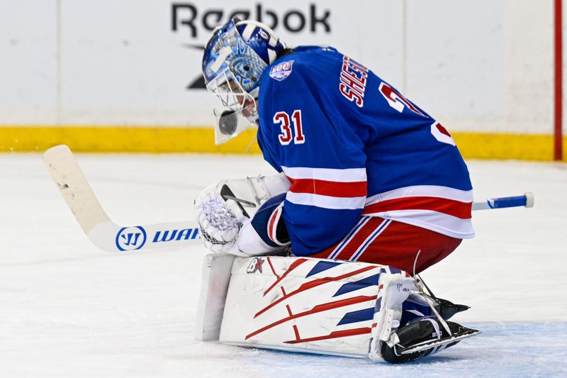 Nov 24, 2025; New York, New York, USA;  New York Rangers goaltender Igor Shesterkin (31) makes a save against the St. Louis Blues during the first period at Madison Square Garden. Mandatory Credit: Dennis Schneidler-Imagn Images