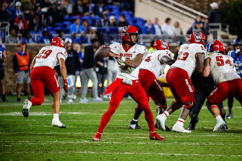 Oct 14, 2023; Durham, North Carolina, USA; North Carolina State Wolfpack quarterback MJ Morris (7) prepares to throw the ball during the second half of the game against Duke Blue Devils at Wallace Wade Stadium. Mandatory Credit: Jaylynn Nash-USA TODAY Sports