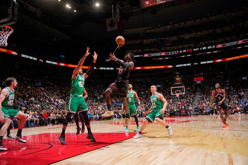 TORONTO, CANADA - JANUARY 15: Dennis Schroder #17 of the Toronto Raptors drives to the basket during the game against the Boston Celtics  on January 15, 2024 at the Scotiabank Arena in Toronto, Ontario, Canada.  NOTE TO USER: User expressly acknowledges and agrees that, by downloading and or using this Photograph, user is consenting to the terms and conditions of the Getty Images License Agreement.  Mandatory Copyright Notice: Copyright 2024 NBAE (Photo by Mark Blinch/NBAE via Getty Images)