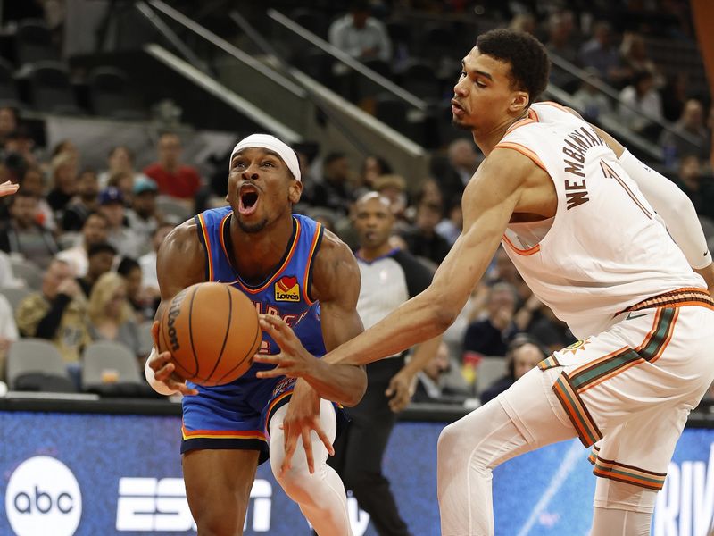 SAN ANTONIO, TX - JANUARY  24: Victor Wembanyama #1 of the San Antonio Spurs fouls Shai Gilgeous-Alexander #2 of the Oklahoma City Thunder in the second half at Frost Bank Center on January 24, 2024 in San Antonio, Texas. NOTE TO USER: User expressly acknowledges and agrees that, by downloading and or using this photograph, User is consenting to terms and conditions of the Getty Images License Agreement. (Photo by Ronald Cortes/Getty Images)