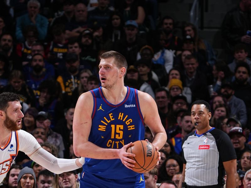 DENVER, CO - MARCH 5: Nikola Jokic #15 of the Denver Nuggets looks to pass the ball during the game against the Phoenix Suns on March 5, 2024 at the Ball Arena in Denver, Colorado. NOTE TO USER: User expressly acknowledges and agrees that, by downloading and/or using this Photograph, user is consenting to the terms and conditions of the Getty Images License Agreement. Mandatory Copyright Notice: Copyright 2024 NBAE (Photo by Garrett Ellwood/NBAE via Getty Images)