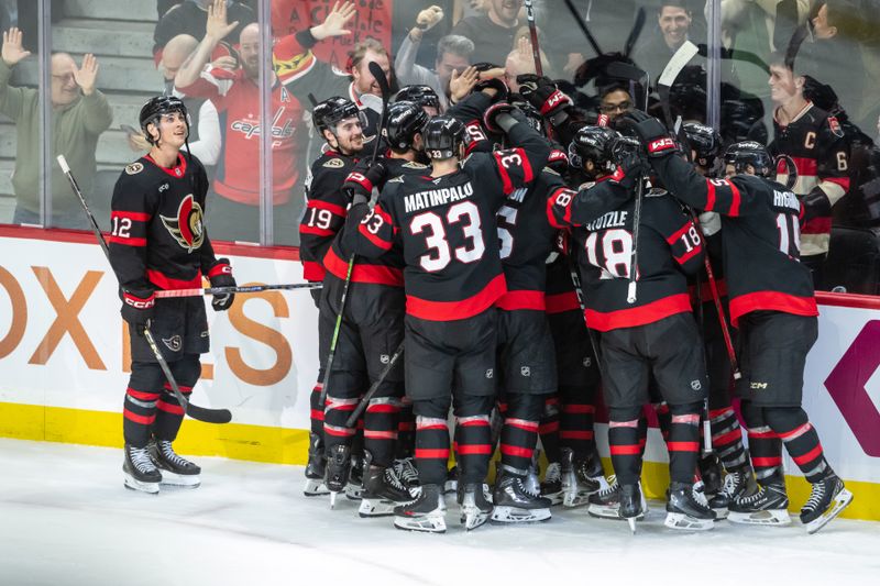 Jan 30, 2025; Ottawa, Ontario, CAN; The Ottawa Senators celebrate a goal scored in ovetime by defenseman Thomas Chabot (72) for their win  against the Washington Capitals at the Canadian Tire Centre. Mandatory Credit: Marc DesRosiers-Imagn Images