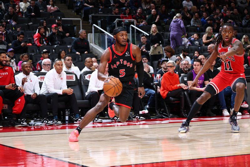 TORONTO, CANADA - JANUARY 31: Immanuel Quickley #5 of the Toronto Raptors dribbles the ball during the game against the Chicago Bulls  on January 31, 2025 at the Scotiabank Arena in Toronto, Ontario, Canada.  NOTE TO USER: User expressly acknowledges and agrees that, by downloading and or using this Photograph, user is consenting to the terms and conditions of the Getty Images License Agreement.  Mandatory Copyright Notice: Copyright 2025 NBAE (Photo by Vaughn Ridley/NBAE via Getty Images)