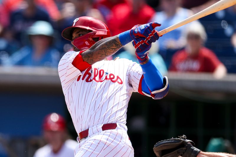 Mar 14, 2024; Clearwater, Florida, USA;  Philadelphia Phillies shortstop Edmundo Sosa (33) hits an rbi single against the Boston Red Sox in the second inning at BayCare Ballpark. Mandatory Credit: Nathan Ray Seebeck-USA TODAY Sports