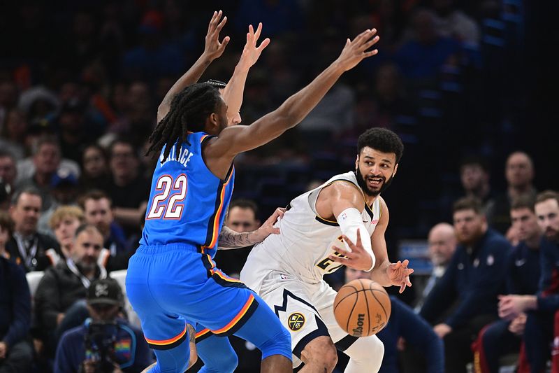 OKLAHOMA CITY, OKLAHOMA - JANUARY 31: Jamal Murray #27 of the Denver Nuggets passes against a double-team by the Oklahoma City Thunder in the first half at Paycom Center on January 31, 2024 in Oklahoma City, Oklahoma. NOTE TO USER: User expressly acknowledges and agrees that, by downloading and or using this Photograph, user is consenting to the terms and conditions of the Getty Images License Agreement. (Photo by Joshua Gateley/Getty Images)