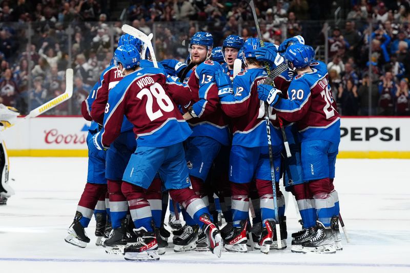 Mar 24, 2024; Denver, Colorado, USA; Members of the Colorado Avalanche celebrate an overtime win against the Pittsburgh Penguins at Ball Arena. Mandatory Credit: Ron Chenoy-USA TODAY Sports