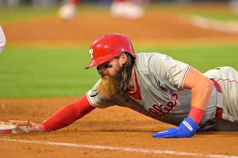 Apr 29, 2024; Anaheim, California, USA; Philadelphia Phillies outfielder Brandon Marsh (16) is safe as he dives back to first in the fourth inning against the Los Angeles Angels at Angel Stadium. Mandatory Credit: Jayne Kamin-Oncea-USA TODAY Sports