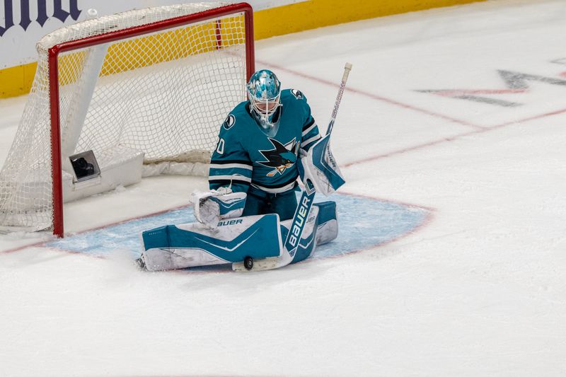 Feb 28, 2026; San Jose, California, USA; San Jose Sharks goaltender Alex Nedeljkovic (33) makes a save against the Edmonton Oilers during the third period at SAP Center at San Jose. Mandatory Credit: Neville E. Guard-Imagn Images