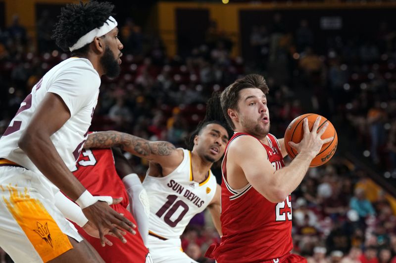 Feb 18, 2023; Tempe, Arizona, USA; Utah Utes guard Rollie Worster (25) drives against the Arizona State Sun Devils during the first half at Desert Financial Arena. Mandatory Credit: Joe Camporeale-USA TODAY Sports