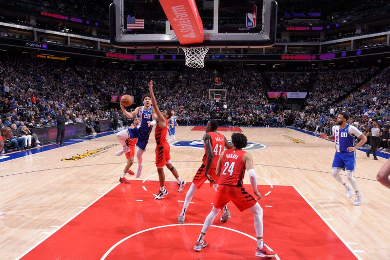 SACRAMENTO, CA - APRIL 14:  Colby Jones #20 of the Sacramento Kings goes to the basket during the game on April 14, 2024 at Golden 1 Center in Sacramento, California. NOTE TO USER: User expressly acknowledges and agrees that, by downloading and or using this Photograph, user is consenting to the terms and conditions of the Getty Images License Agreement. Mandatory Copyright Notice: Copyright 2024 NBAE (Photo by Rocky Widner/NBAE via Getty Images)