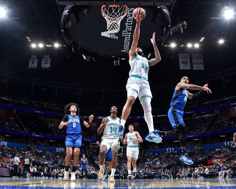 ORLANDO, FL - NOVEMBER 12: Cody Martin #11 of the Charlotte Hornets shoots the ball during the Emirates NBA Cup game against the Orlando Magic on November 12, 2024 at Kia Center in Orlando, Florida. NOTE TO USER: User expressly acknowledges and agrees that, by downloading and or using this photograph, User is consenting to the terms and conditions of the Getty Images License Agreement. Mandatory Copyright Notice: Copyright 2024 NBAE (Photo by Fernando Medina/NBAE via Getty Images)