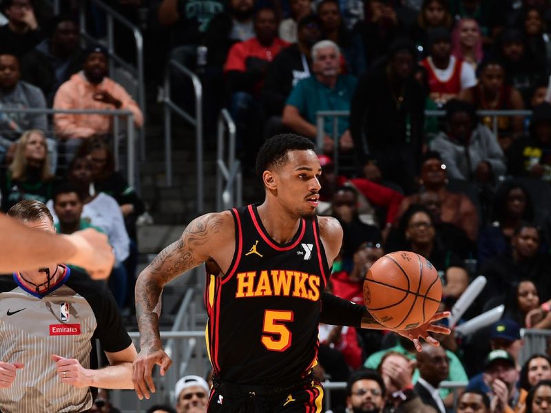 ATLANTA, GA - MARCH 28: Dejounte Murray #5 of the Atlanta Hawks dribbles the ball during the game against the Boston Celtics on March 28, 2024 at State Farm Arena in Atlanta, Georgia.  NOTE TO USER: User expressly acknowledges and agrees that, by downloading and/or using this Photograph, user is consenting to the terms and conditions of the Getty Images License Agreement. Mandatory Copyright Notice: Copyright 2024 NBAE (Photo by Scott Cunningham/NBAE via Getty Images)