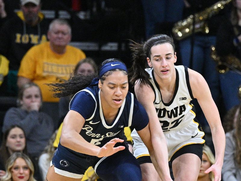 Feb 8, 2024; Iowa City, Iowa, USA; Iowa Hawkeyes guard Caitlin Clark (22) and Penn State Nittany Lions guard Leilani Kapinus (5) battle for a loose ball during the first half at Carver-Hawkeye Arena. Mandatory Credit: Jeffrey Becker-USA TODAY Sports