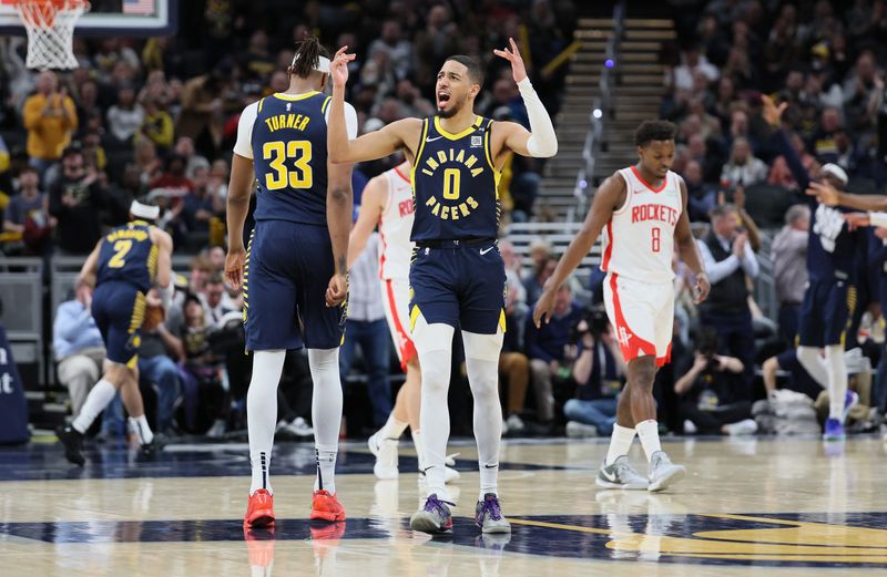 INDIANAPOLIS, INDIANA - FEBRUARY 06: Tyrese Haliburton #0 of the Indiana Pacers celebrates in the second half of the 132-129 win over the Houston Rockets at Gainbridge Fieldhouse on February 06, 2024 in Indianapolis, Indiana.    NOTE TO USER: User expressly acknowledges and agrees that, by downloading and or using this photograph, User is consenting to the terms and conditions of the Getty Images License Agreement.  (Photo by Andy Lyons/Getty Images)