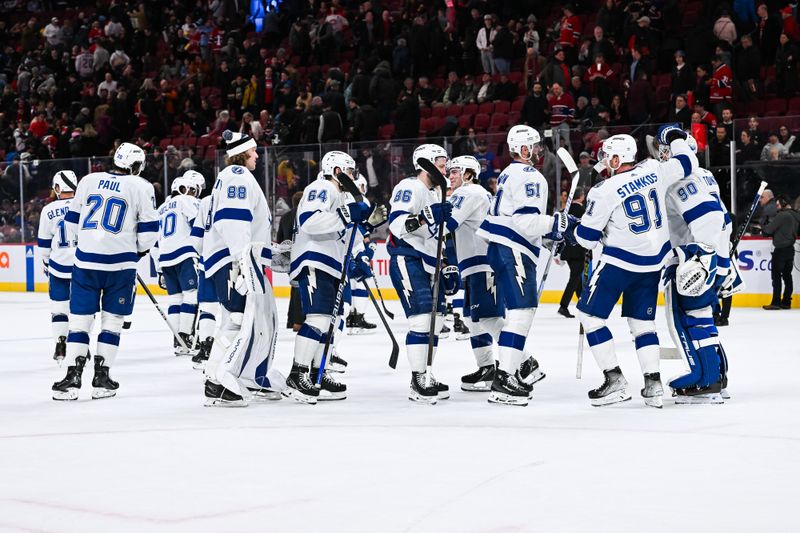 Apr 4, 2024; Montreal, Quebec, CAN; Tampa Bay Lightning players gather to celebrate the win against the Montreal Canadiens after the end of the game at Bell Centre. Mandatory Credit: David Kirouac-USA TODAY Sports