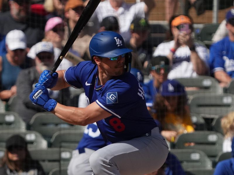 Feb 27, 2025; Salt River Pima-Maricopa, Arizona, USA; Los Angeles Dodgers third base Enrique Hernandez (8) hits against the Colorado Rockies during the first inning at Salt River Fields at Talking Stick. Mandatory Credit: Rick Scuteri-Imagn Images