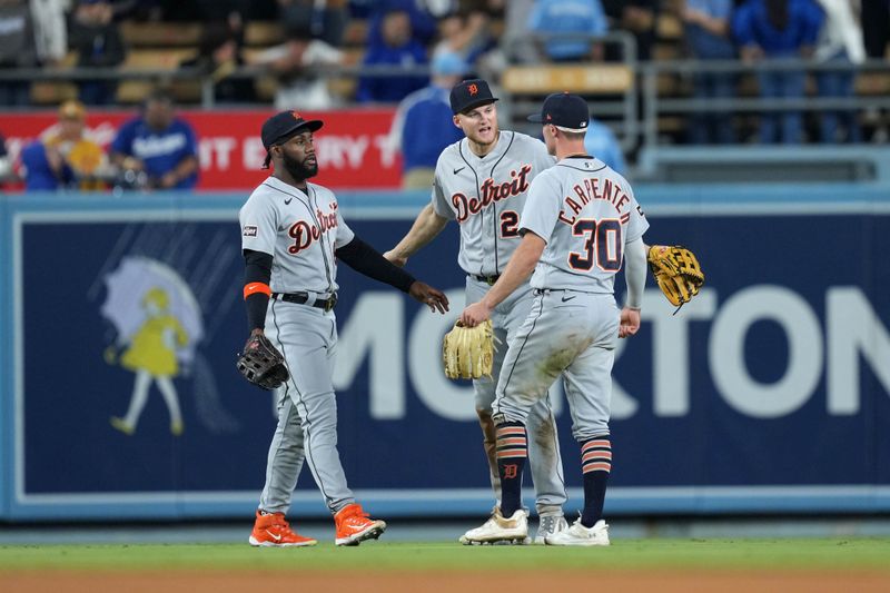 Sep 20, 2023; Los Angeles, California, USA; Detroit Tigers right fielder Kerry Carpenter (30), left fielder Akil Baddoo (60) and center fielder Parker Meadows (22) react at the end of the game against the Los Angeles Dodgers at Dodger Stadium. Mandatory Credit: Kirby Lee-USA TODAY Sports