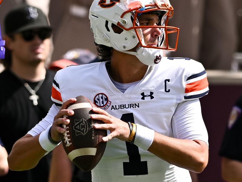 Sep 23, 2023; College Station, Texas, USA; Auburn Tigers quarterback Payton Thorne (1) warms up on the sideline during the first quarter against the Texas A&M Aggies at Kyle Field. Mandatory Credit: Maria Lysaker-USA TODAY Sports