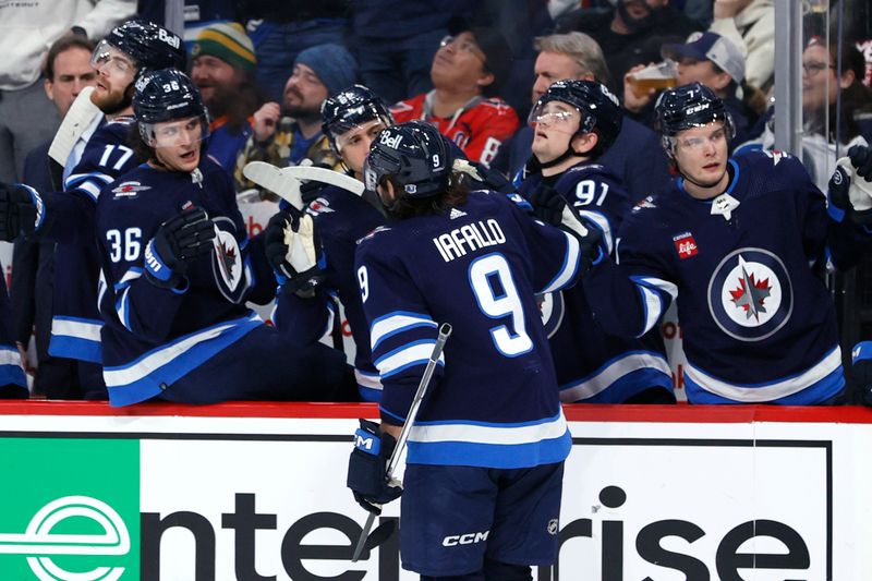 Mar 11, 2024; Winnipeg, Manitoba, CAN; Winnipeg Jets left wing Alex Iafallo (9) celebrates his second period goal against the Washington Capitals at Canada Life Centre. Mandatory Credit: James Carey Lauder-USA TODAY Sports