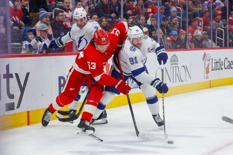 Jan 21, 2024; Detroit, Michigan, USA; Tampa Bay Lightning center Steven Stamkos (91) handles the puck against Detroit Red Wings defenseman Moritz Seider (53) during the third period at Little Caesars Arena. Mandatory Credit: Brian Bradshaw Sevald-USA TODAY Sports