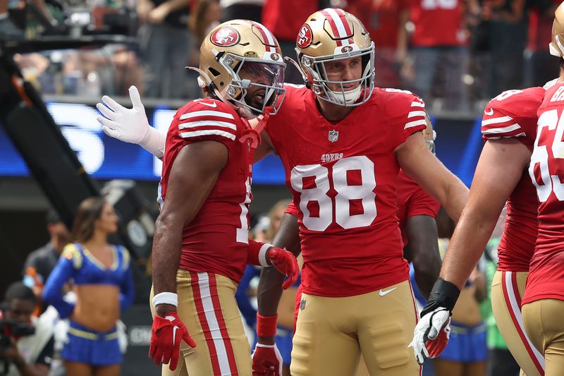 San Francisco 49ers wide receiver Jauan Jennings, left, is congratulated by tight end Jake Tonges (88) after scoring against the Los Angeles Rams during the first half of an NFL football game, Sunday, Sept. 22, 2024, in Inglewood, Calif. (AP Photo/Ryan Sun)