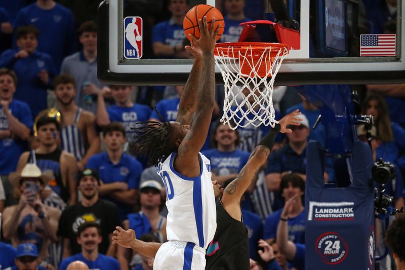Feb 25, 2024; Memphis, Tennessee, USA; Memphis Tigers guard Jaykwon Walton (10) dunks during the second half against the Florida Atlantic Owls at FedExForum. Mandatory Credit: Petre Thomas-USA TODAY Sports