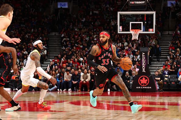 TORONTO, CANADA - DECEMBER 23:  Gary Trent Jr. #33 of the Toronto Raptors handles the ball during the game against the Utah Jazz on December 23, 2023 at the Scotiabank Arena in Toronto, Ontario, Canada.  NOTE TO USER: User expressly acknowledges and agrees that, by downloading and or using this Photograph, user is consenting to the terms and conditions of the Getty Images License Agreement.  Mandatory Copyright Notice: Copyright 2023 NBAE (Photo by Vaughn Ridley/NBAE via Getty Images)